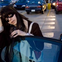 Woman wearing a black caper mask